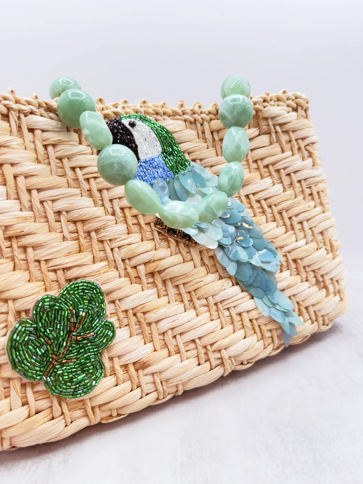 Parrot Paradise Handcrafted Bag – Natural Straw Fiber with Embellished Sequins and Resin Handle