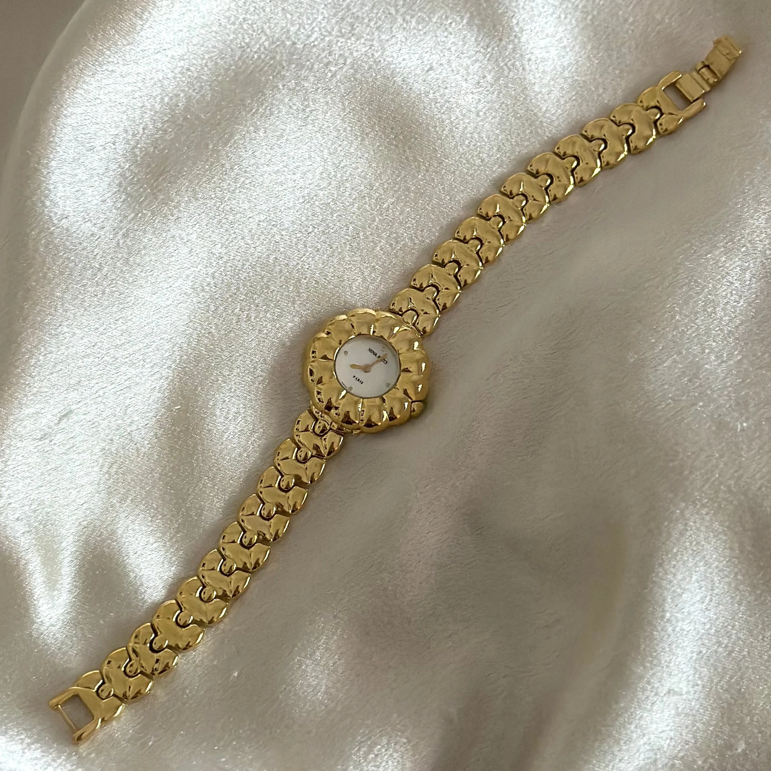 VINTAGE NINA RICCI MOTHER-OF-PEARL DIAMOND WATCH