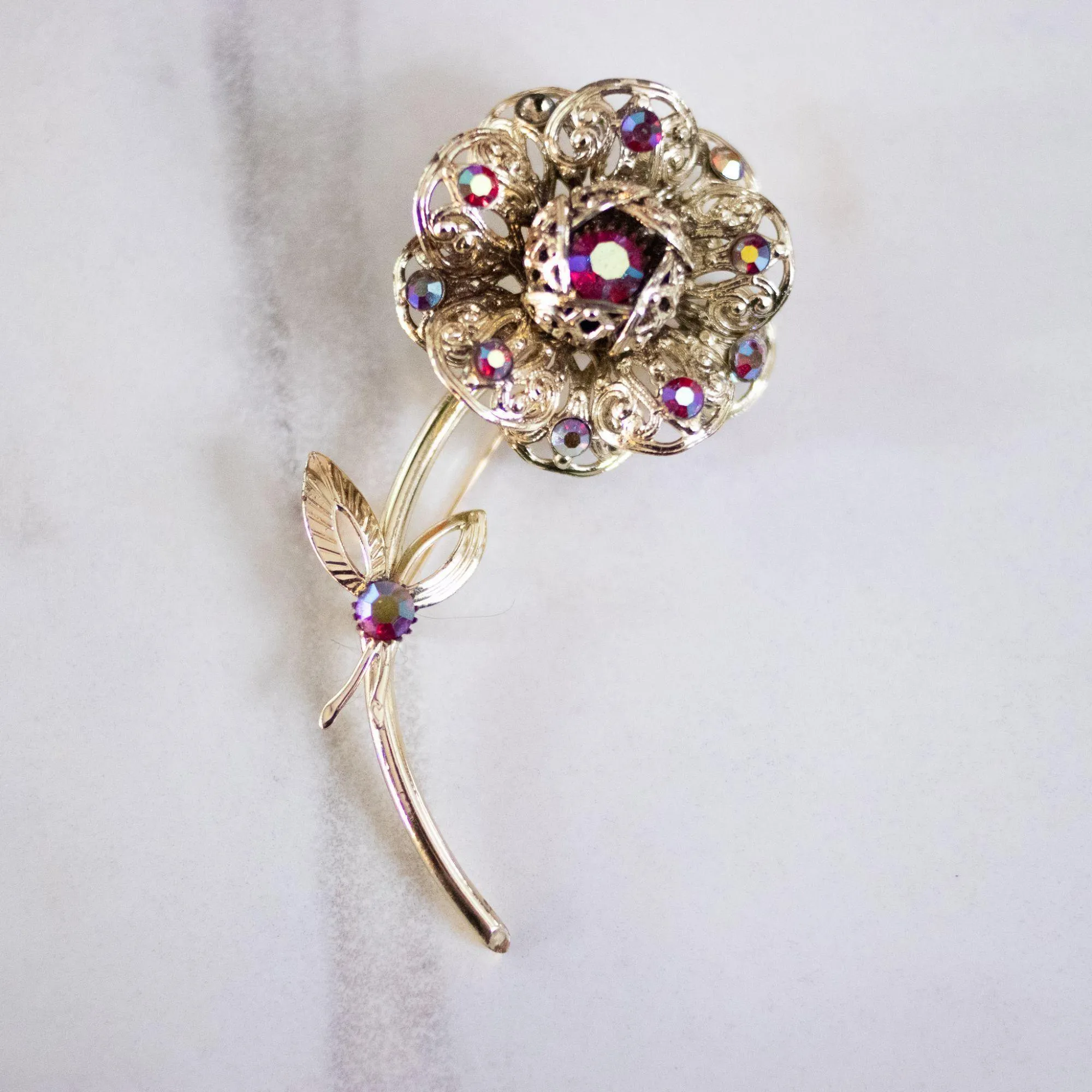 Vintage Sarah Coventry Gold Flower Brooch with Red Aurora Borealis Rhinestones